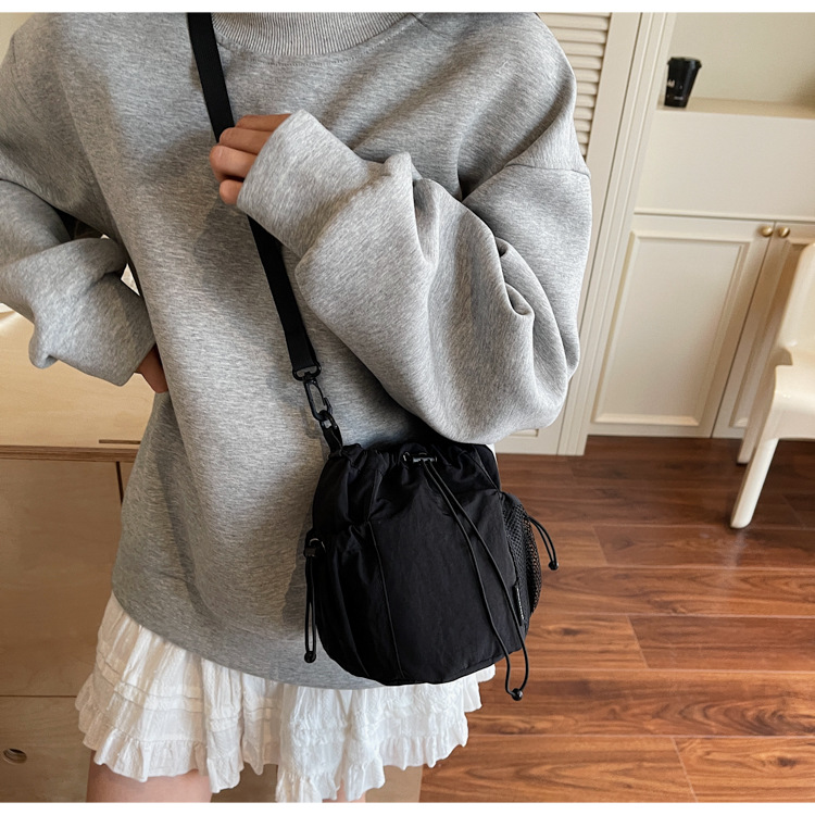 Lightweight and casual crossbody bag drawstring opening