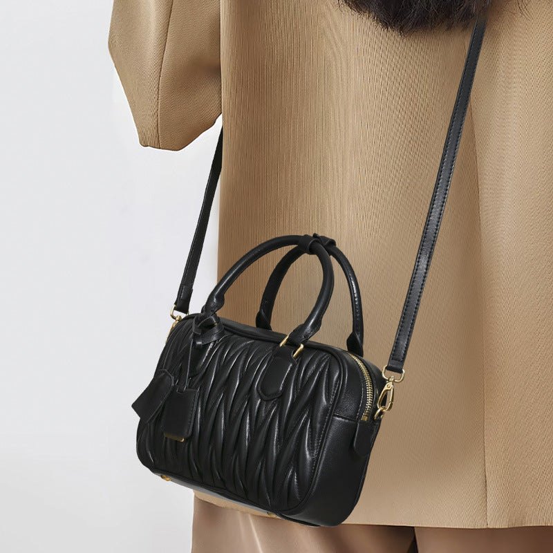 Sheepskin pleated bowling ball hand-held crossbody bag