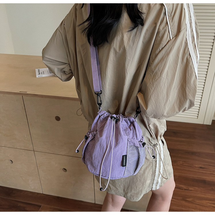 Lightweight and casual crossbody bag drawstring opening
