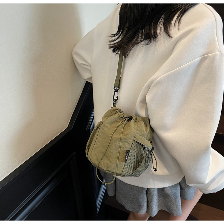 Lightweight and casual crossbody bag drawstring opening