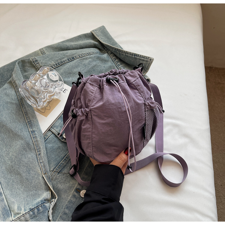 Lightweight and casual crossbody bag drawstring opening