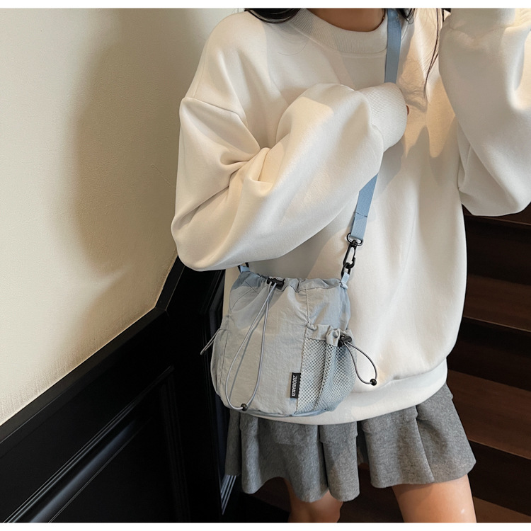 Lightweight and casual crossbody bag drawstring opening