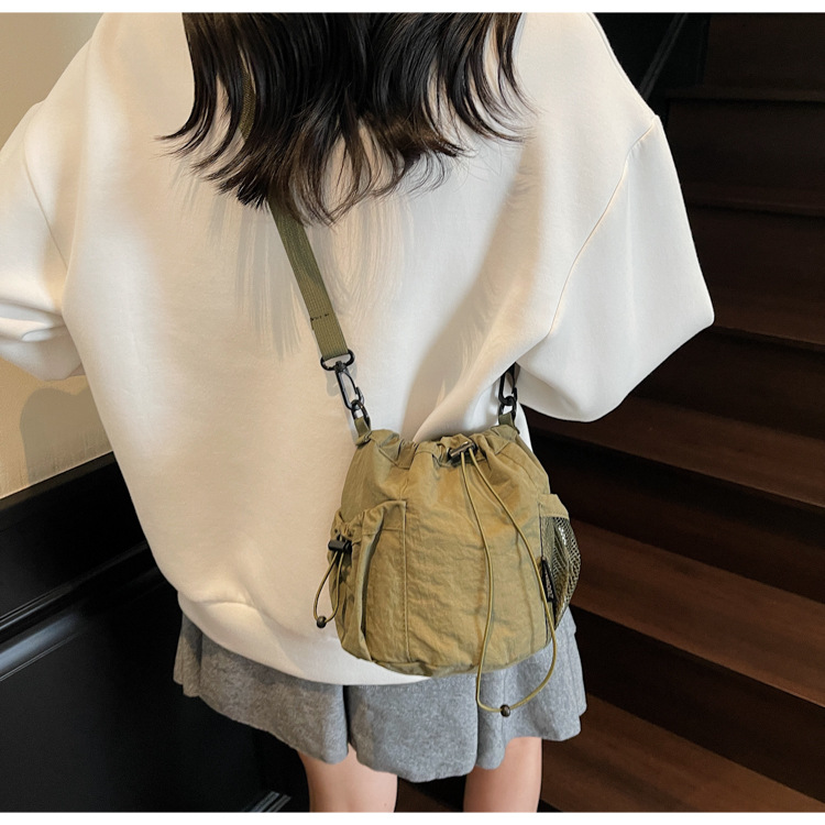 Lightweight and casual crossbody bag drawstring opening