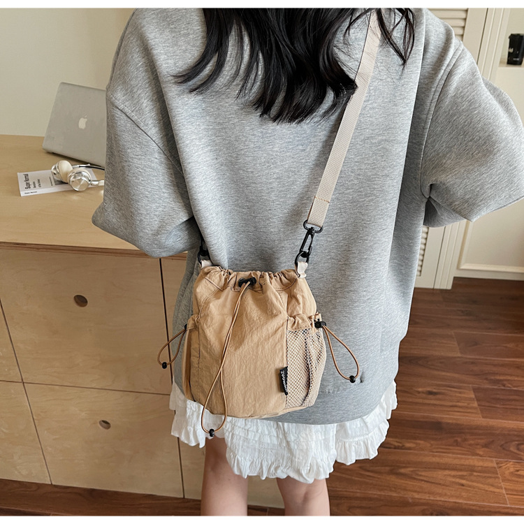 Lightweight and casual crossbody bag drawstring opening