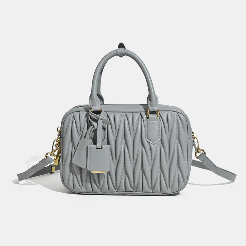 Sheepskin pleated bowling ball hand-held crossbody bag