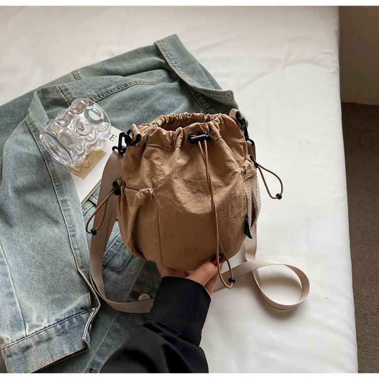 Lightweight and casual crossbody bag drawstring opening