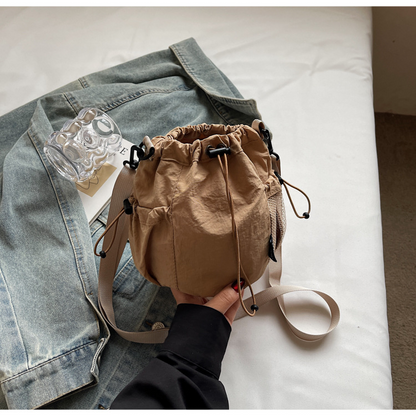Lightweight and casual crossbody bag drawstring opening