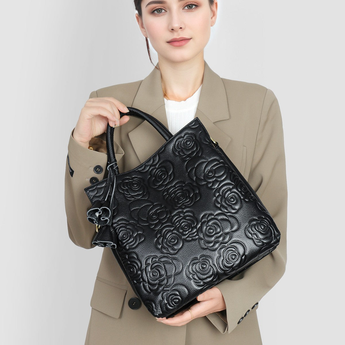 Camellia embossed tassel cowhide crossbody bag