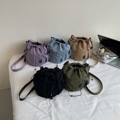 Lightweight and casual crossbody bag drawstring opening