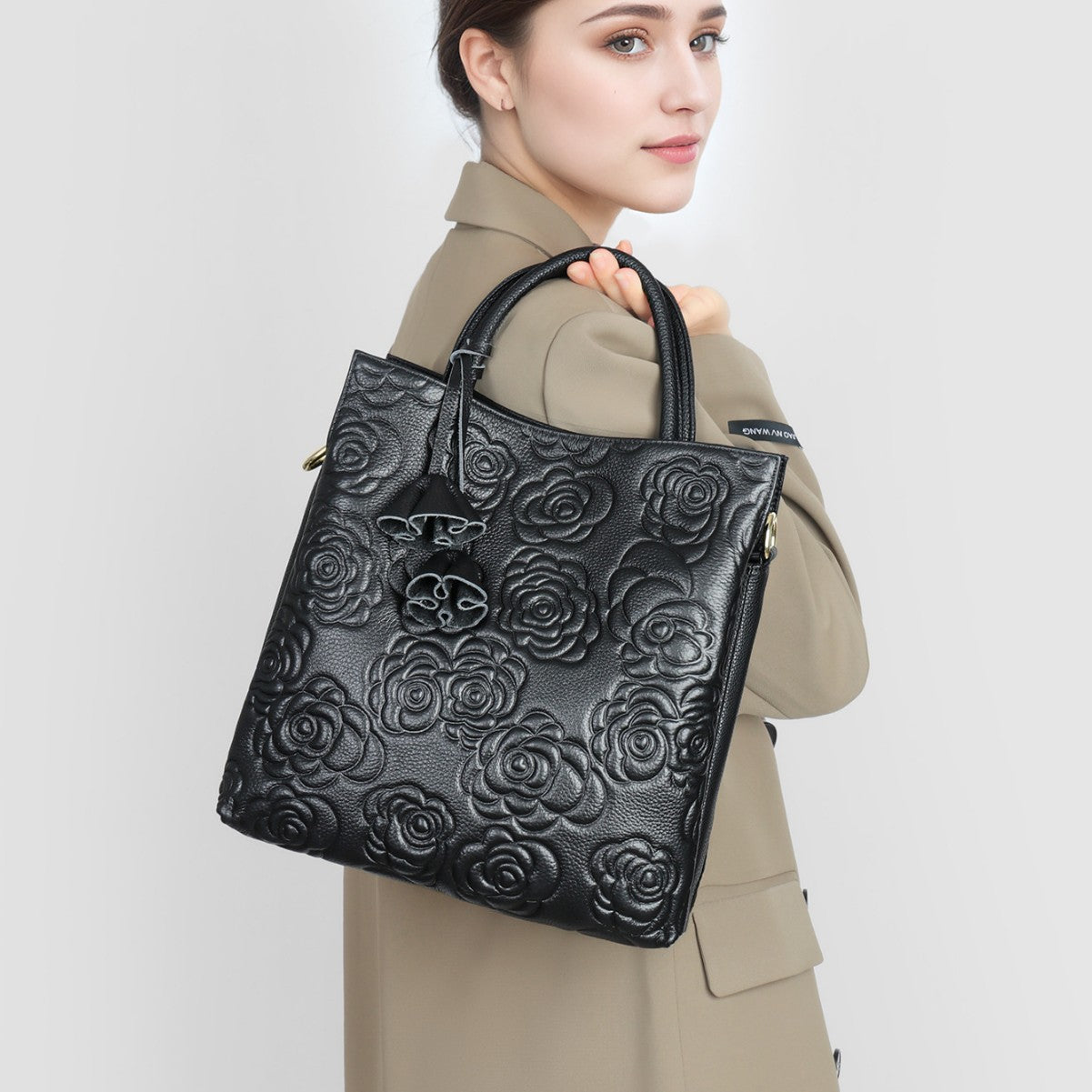 Camellia embossed tassel cowhide crossbody bag