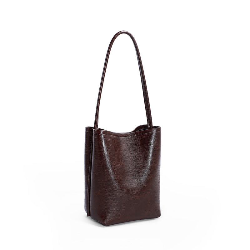 Fashionable suction button simple one shoulder bag