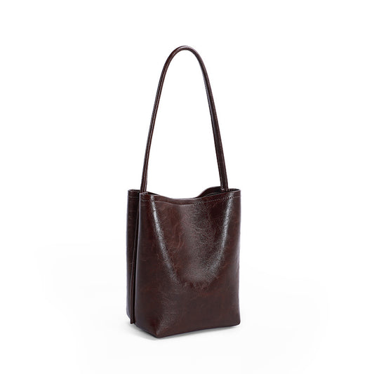 Fashionable suction button simple one shoulder bag