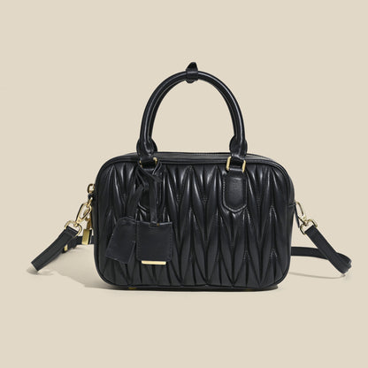 Sheepskin pleated bowling ball hand-held crossbody bag