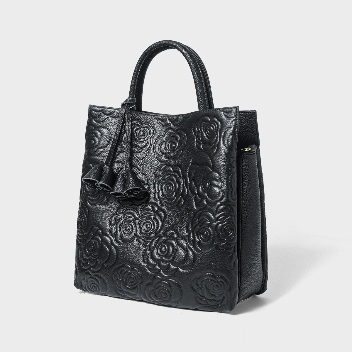 Camellia embossed tassel cowhide crossbody bag