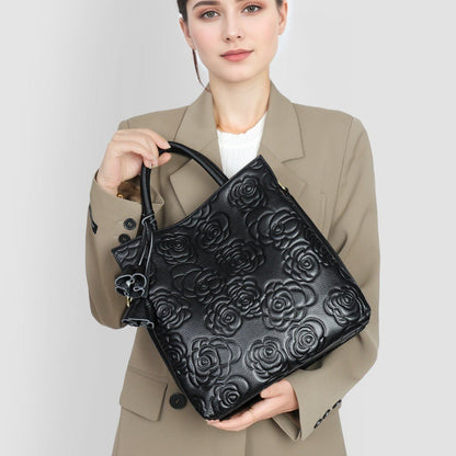 Camellia embossed tassel cowhide crossbody bag - zoraflux