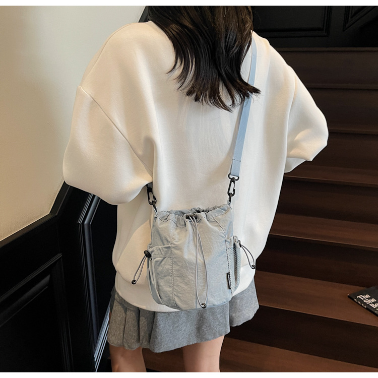Lightweight and casual crossbody bag drawstring opening