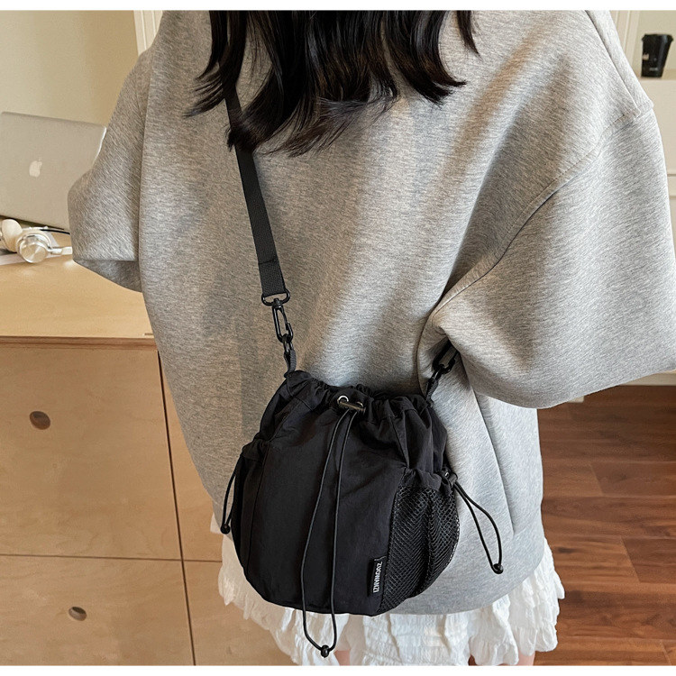 Lightweight and casual crossbody bag drawstring opening