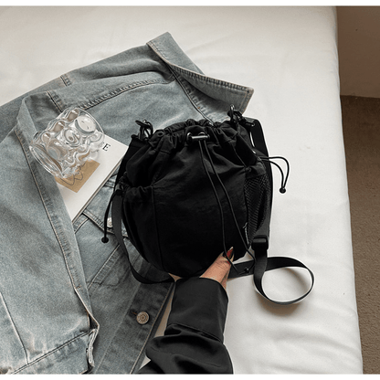 Lightweight and casual crossbody bag drawstring opening - zoraflux