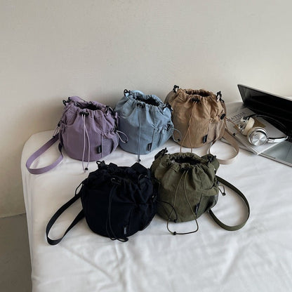 Lightweight and casual crossbody bag drawstring opening - zoraflux